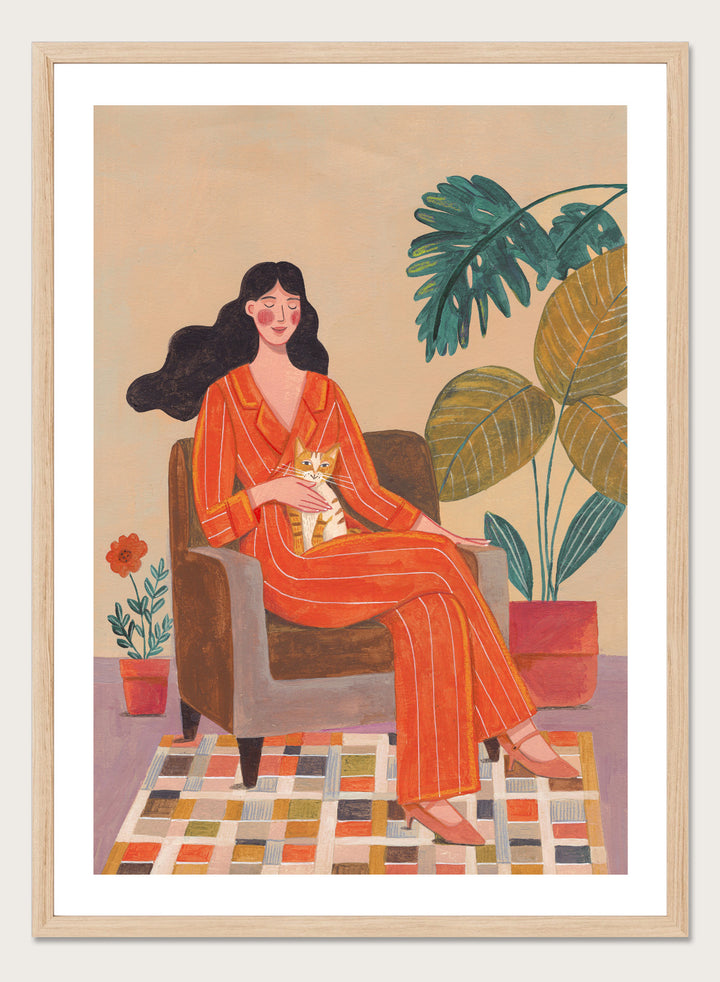 Illustration of a woman in an orange outfit sitting in a chair with plants around her. Cozy Home with Cat by Caroline Bonne Müller is a fine art print and wall poster featuring a woman in an orange outfit sitting with a cat in a warm, plant-filled interior.