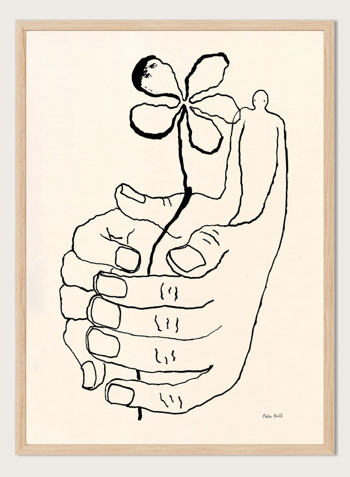 Black line drawing of a hand holding a flower on a beige background. Let It Grow by Eden Kalif is a modern line art print featuring a hand holding a flower with a human figure, designed as a minimalist contemporary wall poster.