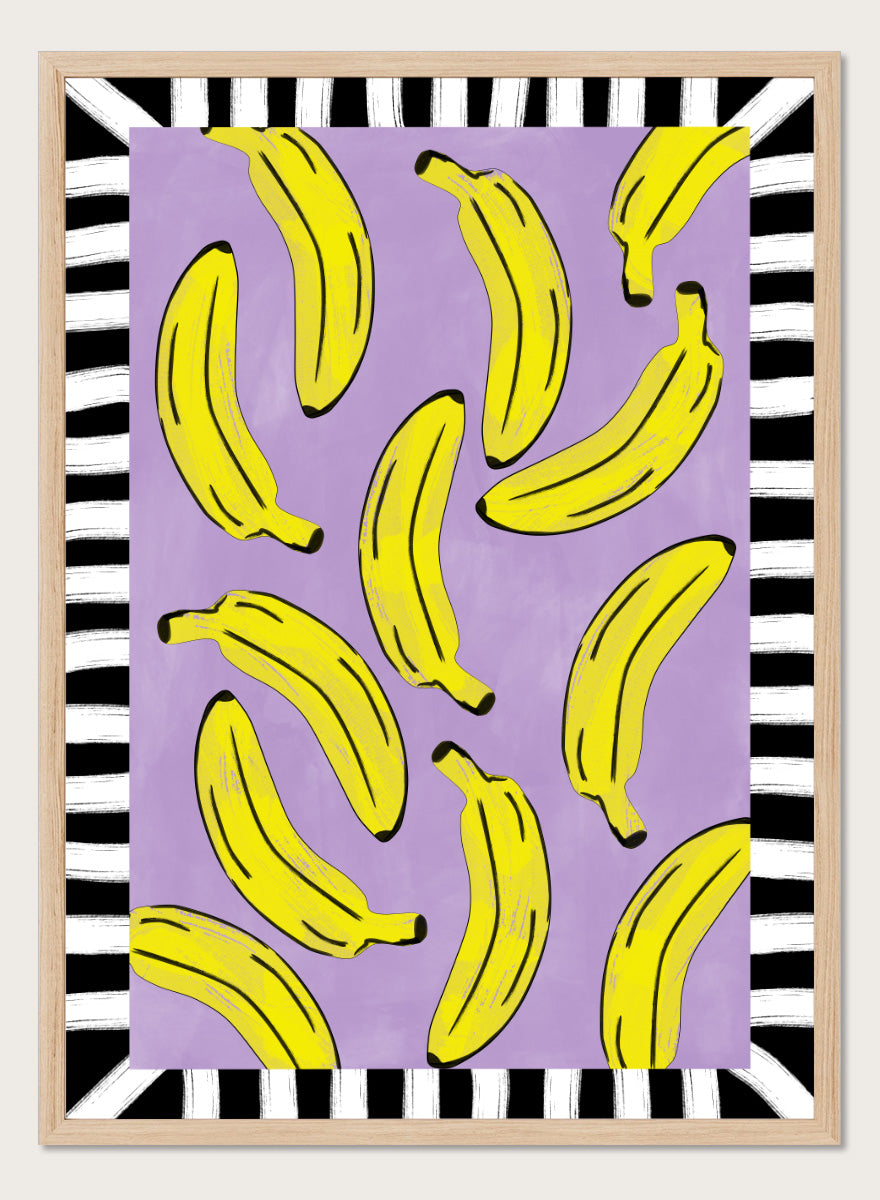 Shop Playful Banana Scatter by Elena Ristova, a banana wall art print poster in yellow, purple, black, and white with a bold striped border.