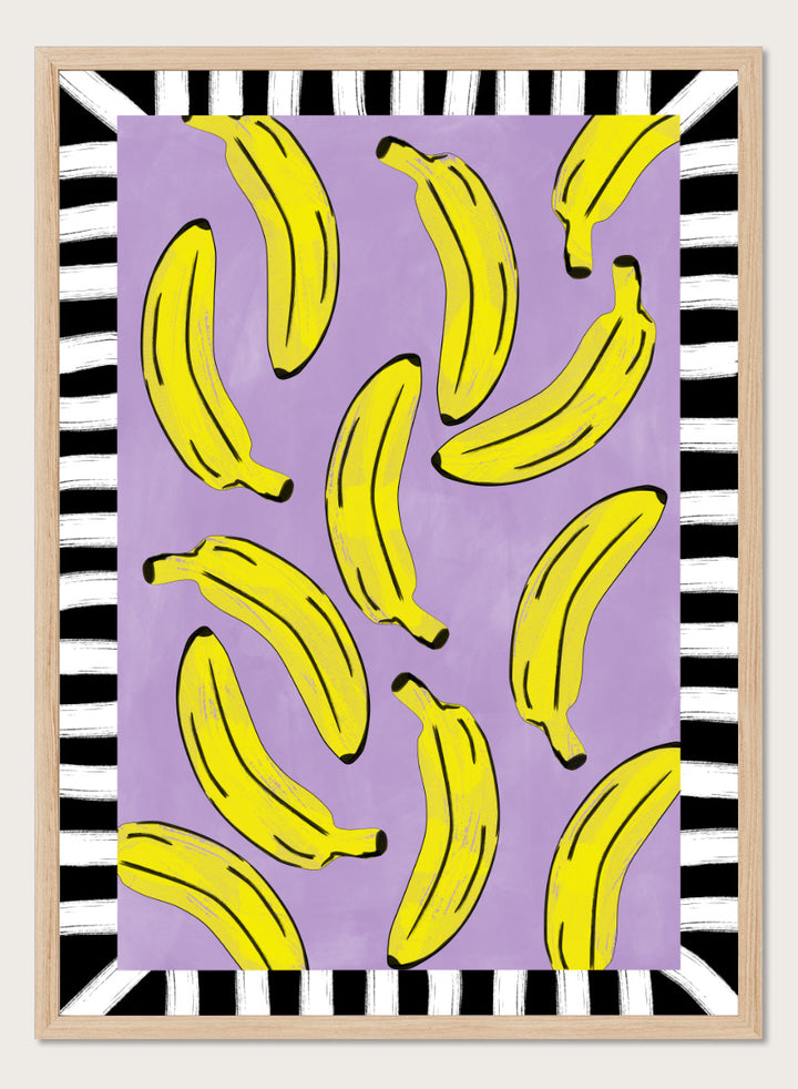 Shop Playful Banana Scatter by Elena Ristova, a banana wall art print poster in yellow, purple, black, and white with a bold striped border.