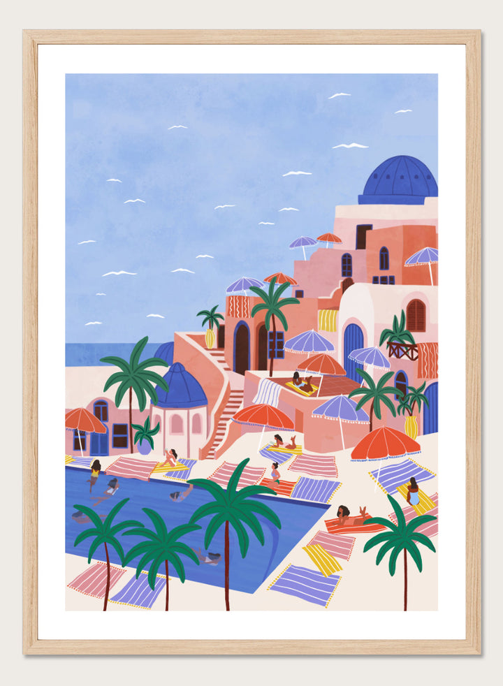 A stylized art print depicting a Mediterranean resort scene with palm trees, beach umbrellas, lounge chairs, a swimming pool, and pastel-colored buildings under a light blue sky. Mediterranean Poolside Retreat by Ceyda Alasar travel art print featuring a colorful coastal resort, palm trees, sunbathers, striped umbrellas, and sea views.
