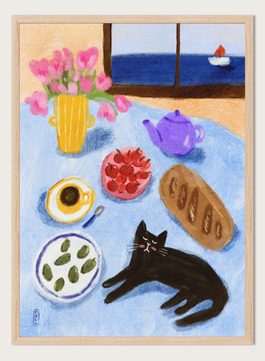 A colorful still life painting of a table scene with pink tulips in a yellow vase, a purple teapot, a bowl of strawberries, a cup of coffee, a loaf of bread, a black cat, and a window view of the sea with a small sailboat. Shop Relaxing Seaside Cat Breakfast by Dirkie Nell, a playful cat and food art print featuring breakfast, flowers, a sailboat, and a seaside view.