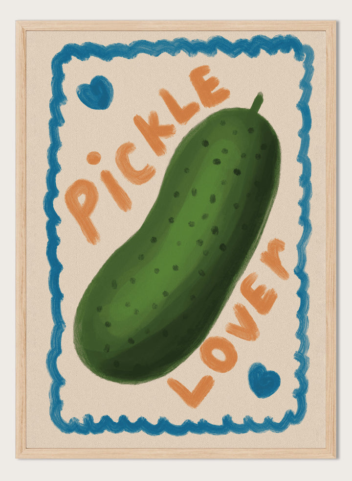 An art print featuring a hand-drawn green pickle centered on a cream background, surrounded by a blue scalloped border. The words &