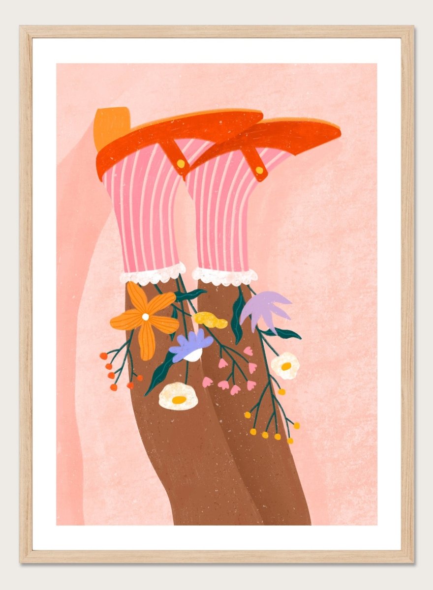 A stylized art print featuring a pair of legs wearing pink striped socks with white ruffles, decorated with colorful wildflowers, and topped with orange high-heeled shoes, set against a textured pink background. Happy Feet and Flowers by Bea Müller premium framed fine art print featuring red Mary Janes, striped socks, and colorful flowers on a soft pink background.