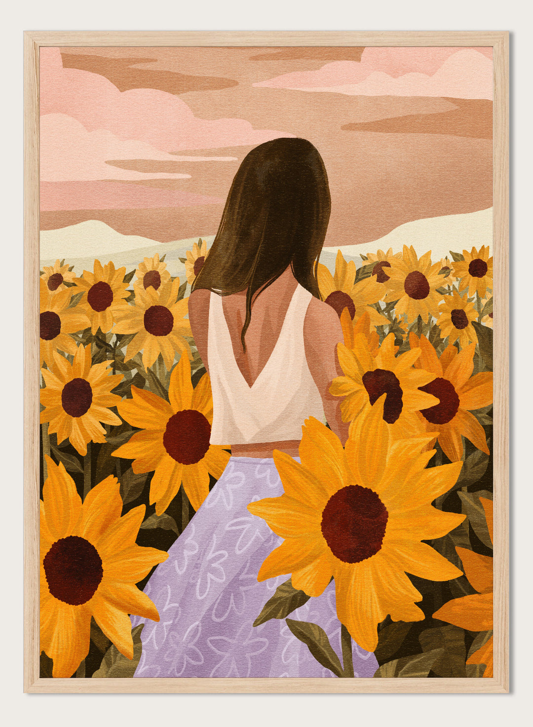 Woman in a white top and purple pants sitting among sunflowers with a scenic background. Sunflower Evenings by Goed Blauw is a fine art print and wall poster featuring a woman standing in a sunflower field with warm golden tones.