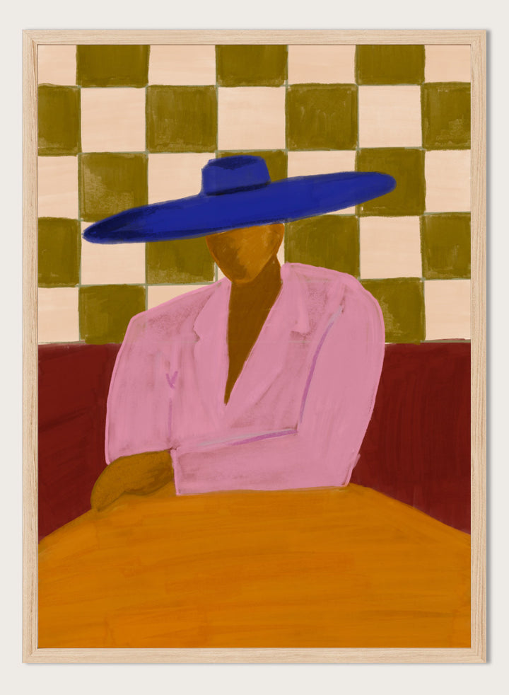 A stylized painting of a seated figure wearing a wide blue hat and pink top, with a red couch and a beige-and-olive checkered wall behind them. Blue Hat Chic by The Art Concept portrait art print featuring a cobalt blue hat, pink jacket, checkerboard backdrop, and bold modern color.