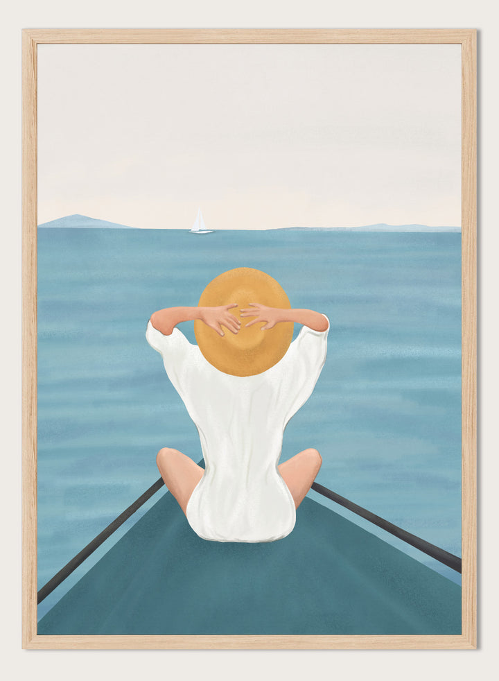 Person sitting on a dock over water wearing a white dress and straw hat. Ocean Escape by Flow Line features a woman sitting on a boat overlooking the sea, creating a coastal art print inspired by travel, summer, and ocean living.
