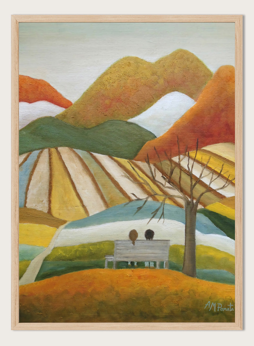 A stylized landscape painting with layered mountains, terraced fields, a bare tree, and two small figures seated on a bench in the foreground. Shop Couple On Autumn Bench by Angeles M. Pomata, an autumn landscape and figurative art print featuring a seated couple, rolling hills, patchwork fields, and warm fall tones.