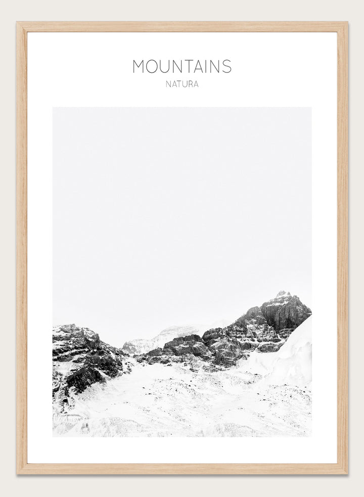 Black and white mountain landscape with 'Mountains Natura' text. Serene Peaks by The MIUUS Studio is a black and white mountain photography art print and wall poster featuring snowy peaks, minimalist composition, and modern neutral design.