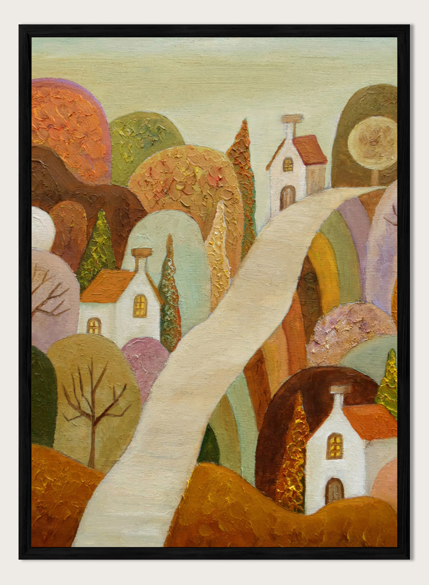 A stylized landscape painting featuring small white houses with orange roofs, rolling hills in earthy tones, and a pale winding path through the scene. Shop Whimsical Village Path by Angeles M. Pomata, an autumn landscape art print featuring a winding road, white village houses, rounded hills, and warm earthy tones.