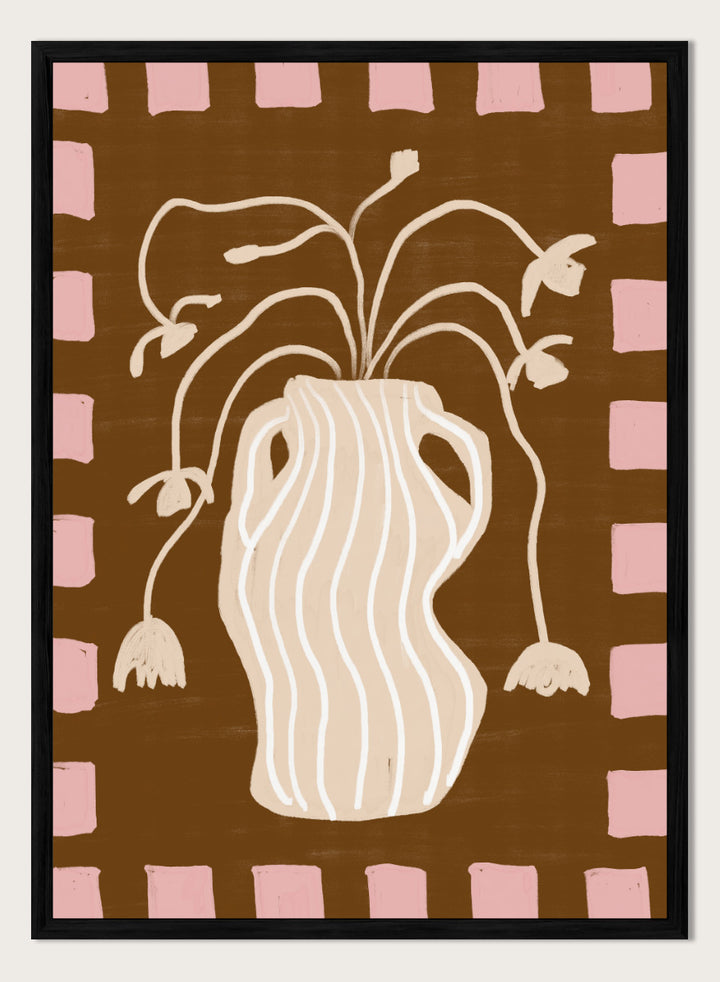 A stylized art print featuring a cream-colored wavy vase with stems and hanging flower buds on a brown background, framed by a pink and brown checkered border. Soft Floral Arrangement by The Art Concept still life art print featuring a striped vase, drooping flowers, warm brown tones, and a soft pink border.