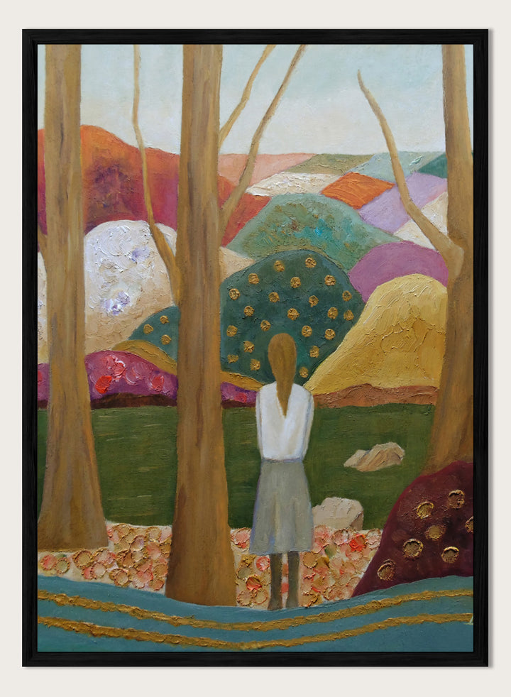 An expressive painting of a woman seen from behind standing among tall trees in a stylized landscape with colorful hills, patches of green, purple, pink, blue, and gold accents. Shop Woman Among Vibrant Hills by Angeles M. Pomata, a colorful landscape and portrait art print featuring a woman, rolling hills, trees, and earthy tones.