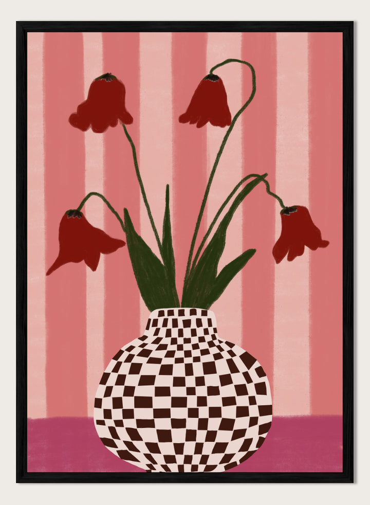 A stylized floral artwork showing four dark red bell-shaped flowers with long green stems rising from a black-and-white checkerboard vase, set against pink vertical stripes and a pink base. Whimsical Flowers Checkered Vase by The Art Concept still life art print featuring red flowers, a checkered vase, and a soft pink striped background.