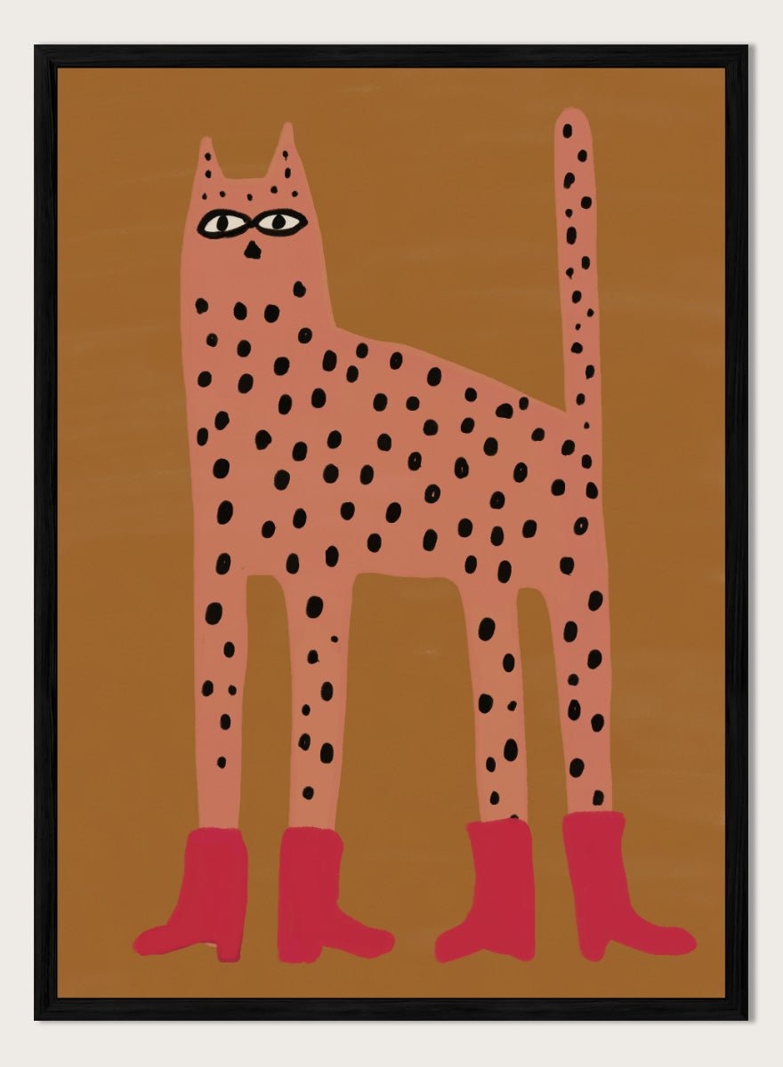 A stylized art print of a tall spotted cat in a pinkish-orange tone with black spots and bright pink boots, set against a warm brown background. Spotted Cat in Boots by The Art Concept playful cat art print featuring a pink spotted cat with long legs, red boots, and a warm ochre background.