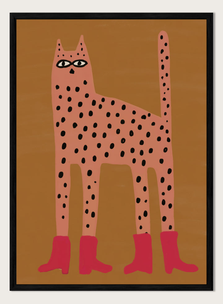 A stylized art print of a tall spotted cat in a pinkish-orange tone with black spots and bright pink boots, set against a warm brown background. Spotted Cat in Boots by The Art Concept playful cat art print featuring a pink spotted cat with long legs, red boots, and a warm ochre background.