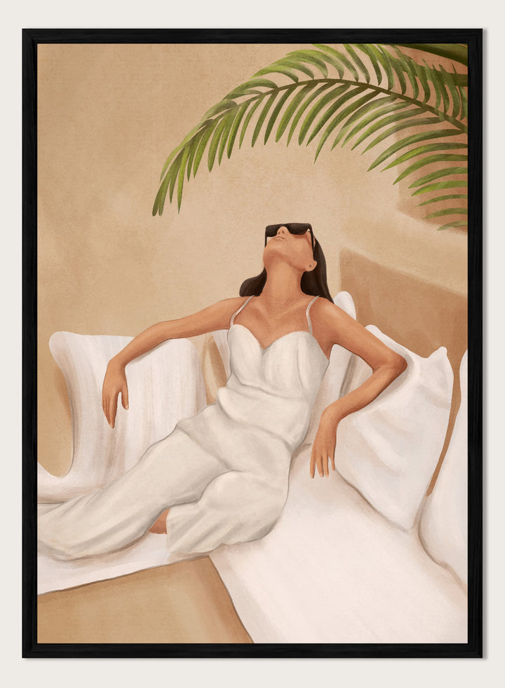 Woman in a white dress lying on a couch with a palm leaf above, against a beige wall. Chic Summer Serenity by City Art features a woman reclining among cushions and palm leaves, bringing warm summer tones and relaxed interiors to your home.