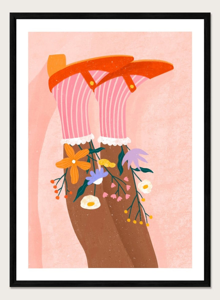 A stylized art print featuring a pair of legs wearing pink striped socks with white ruffles, decorated with colorful wildflowers, and topped with orange high-heeled shoes, set against a textured pink background. Happy Feet and Flowers by Bea Müller premium framed fine art print featuring red Mary Janes, striped socks, and colorful flowers on a soft pink background.