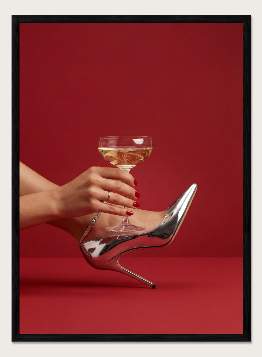 High-heeled shoe holding a glass of white wine against a red background, High Heels and Champagne by Andreas Magnusson is a fashion illustration art print featuring high heels, champagne glass imagery, bold red tones, and modern contemporary wall art style.