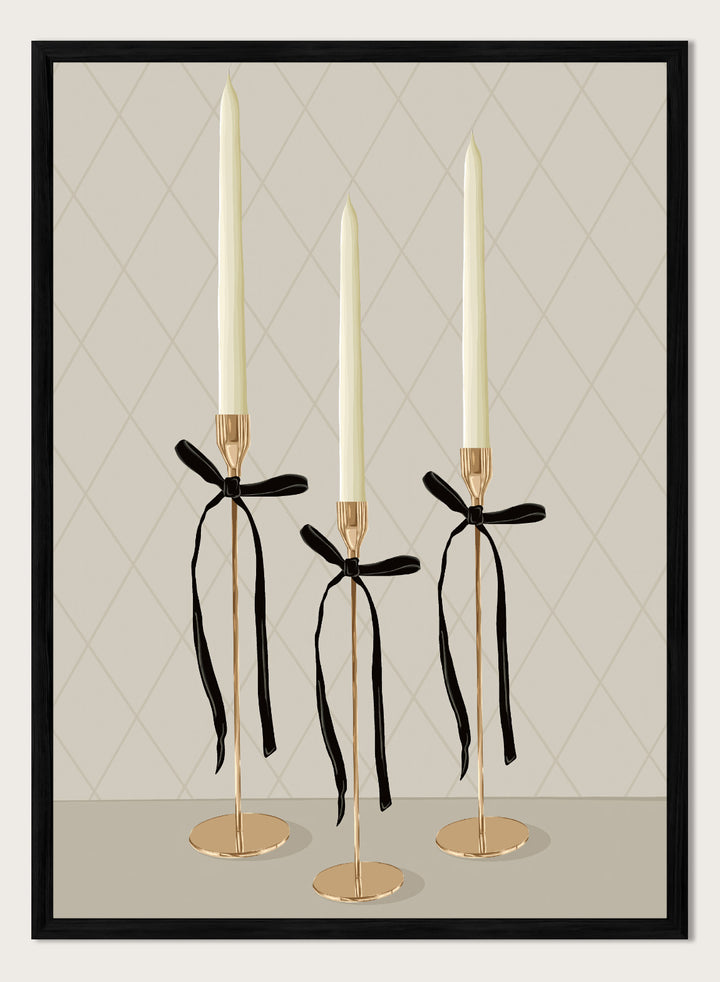 Three gold taper candle holders with cream candles and black ribbon bows, arranged on a light gray surface against a beige diamond-patterned background. Elegant Gold Taper Candles by Lisa Solomoniuk premium framed fine art print featuring gold candlesticks, cream tapers, and long black ribbons.