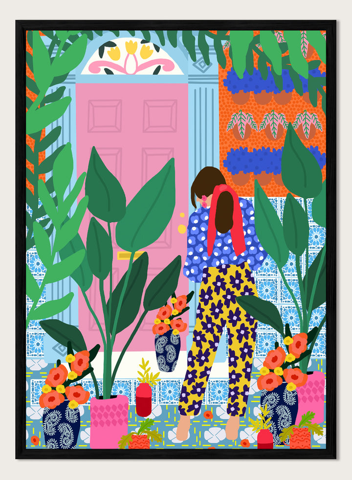 Illustration of a person in colorful pants standing in front of a pink door with plants and flowers. Floral Oasis Retreat by Rafaela Mascaro art print featuring woman in lush garden doorway, colorful plants, patterned tiles, and vibrant contemporary botanical wall art poster.