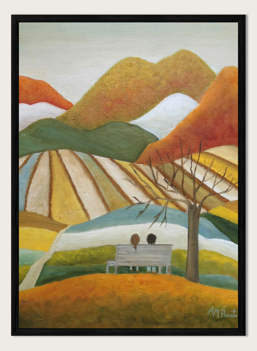 A stylized landscape painting with layered mountains, terraced fields, a bare tree, and two small figures seated on a bench in the foreground. Shop Couple On Autumn Bench by Angeles M. Pomata, an autumn landscape and figurative art print featuring a seated couple, rolling hills, patchwork fields, and warm fall tones.
