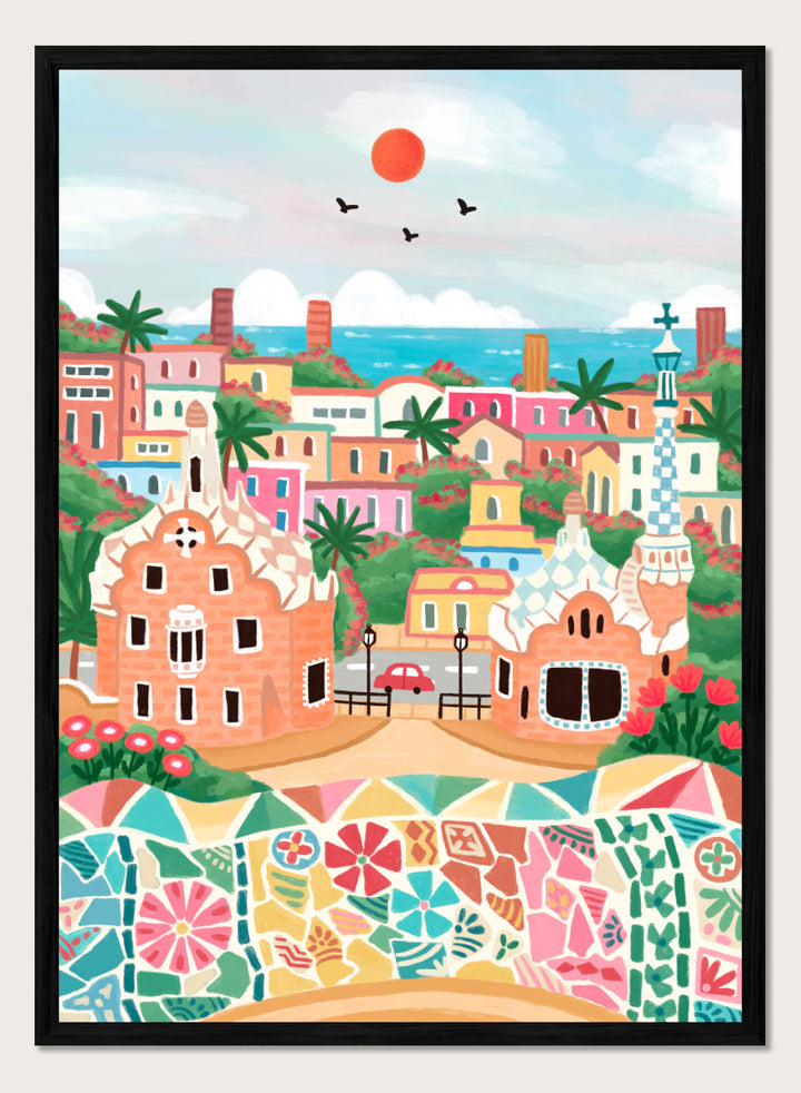 A colorful stylized illustration of a coastal town with pastel buildings, palm trees, a mosaic wall in the foreground, blue sea, and a red sun in the sky. Shop Colorful Coastal Dream by Nidhi Kachhadiya, a vibrant Barcelona wall art print inspired by Park Güell, Gaudí architecture, mosaics, and bright coastal color.