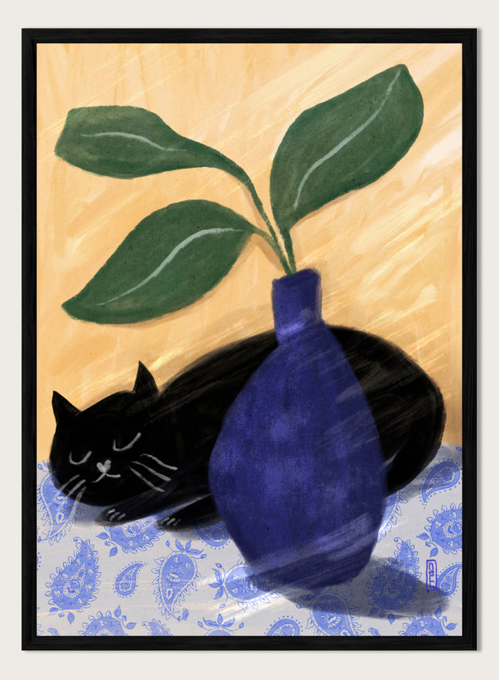 A stylized still life painting featuring a black cat lying on a blue-and-white patterned surface beside a dark blue vase with green leaves, against a warm beige background. Shop the Sleeping Black Cat art print by Dirkie Nell, featuring a curled black cat, bold cobalt blue vase, green leaves and playful patterned details.