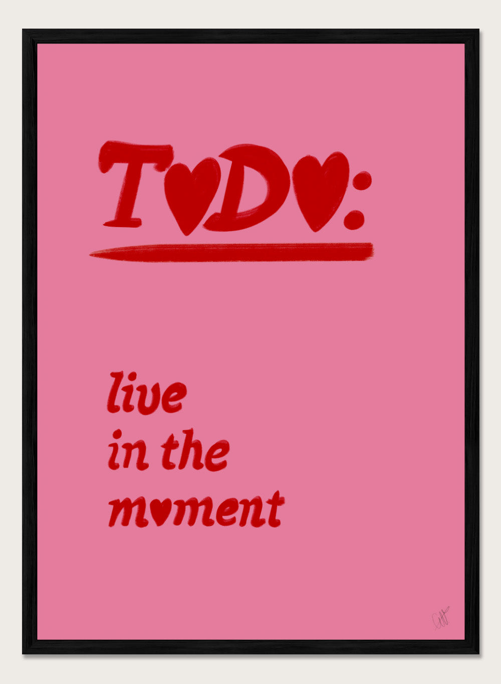 Pink poster with red text 'TODO: live in the moment' on a pink background. Typography wall art reading “live in the moment” with red hearts on pink background by Anne-Marie Volfova. Officially licensed motivational art print.