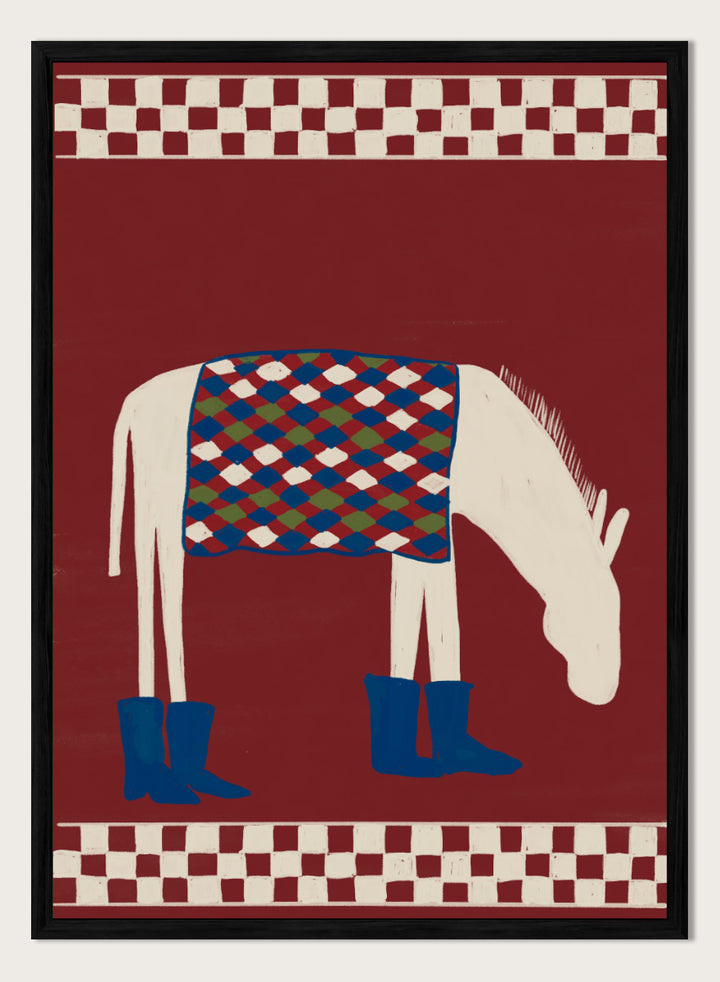 A stylized folk-art illustration of a white horse with a patterned blue, green, and red saddle blanket and blue boots, set against a dark red background with cream-and-red checkered borders at the top and bottom. Whimsical Donkey In Boots by The Art Concept animal art print featuring a white donkey in blue boots with a patterned blanket and rich red background.