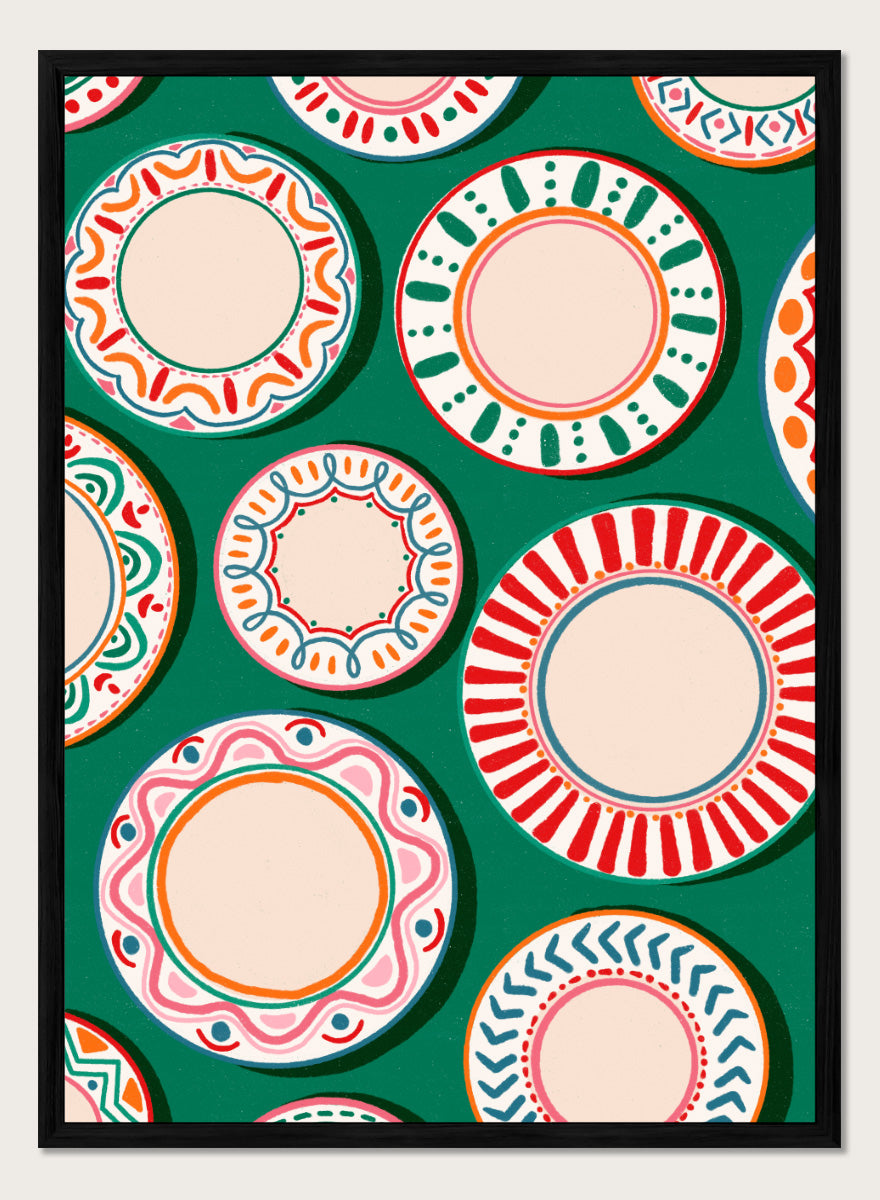 A flat-lay pattern of colorful decorative plates on a dark green background, featuring a variety of circular designs in red, orange, pink, blue, and cream. Shop Colorful Patterned Plates by Nidhi Kachhadiya, a playful kitchen wall art print featuring decorative plates, folk-inspired patterns, and bold green, red, and pink tones.