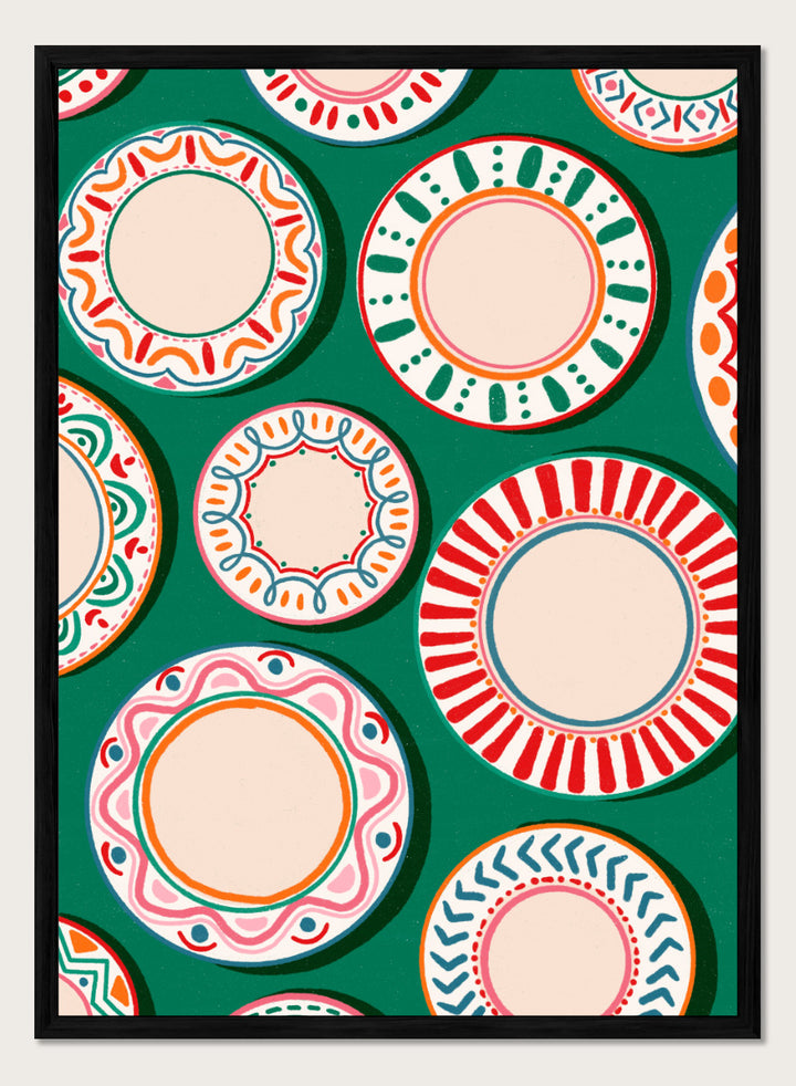 A flat-lay pattern of colorful decorative plates on a dark green background, featuring a variety of circular designs in red, orange, pink, blue, and cream. Shop Colorful Patterned Plates by Nidhi Kachhadiya, a playful kitchen wall art print featuring decorative plates, folk-inspired patterns, and bold green, red, and pink tones.