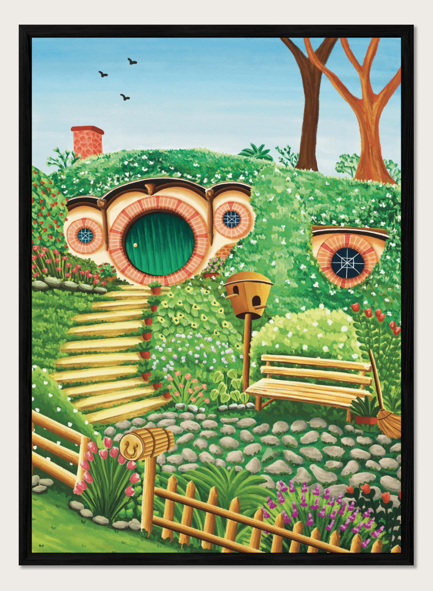 A colorful fantasy-style illustration of a hobbit hillside scene with a round green door, stone steps, flowers, trees, a bench, and a birdhouse under a blue sky. Shop Whimsical Hill House by Nidhi Kachhadiya, a colorful cottage wall art print featuring a garden home, lush greenery, flowers, and playful storybook details.