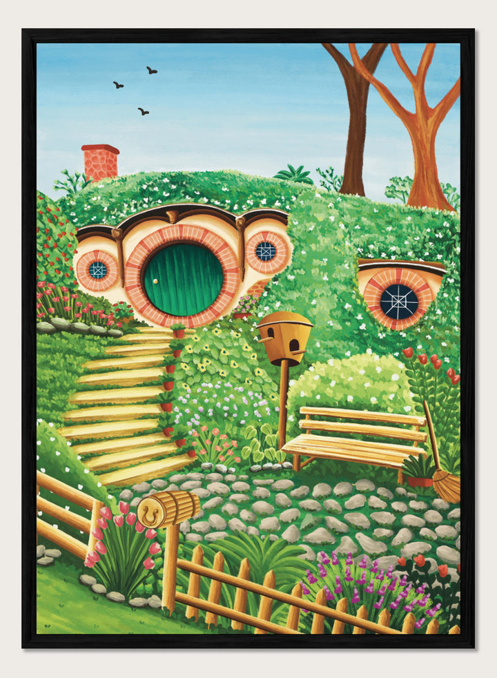 A colorful fantasy-style illustration of a hobbit hillside scene with a round green door, stone steps, flowers, trees, a bench, and a birdhouse under a blue sky. Shop Whimsical Hill House by Nidhi Kachhadiya, a colorful cottage wall art print featuring a garden home, lush greenery, flowers, and playful storybook details.
