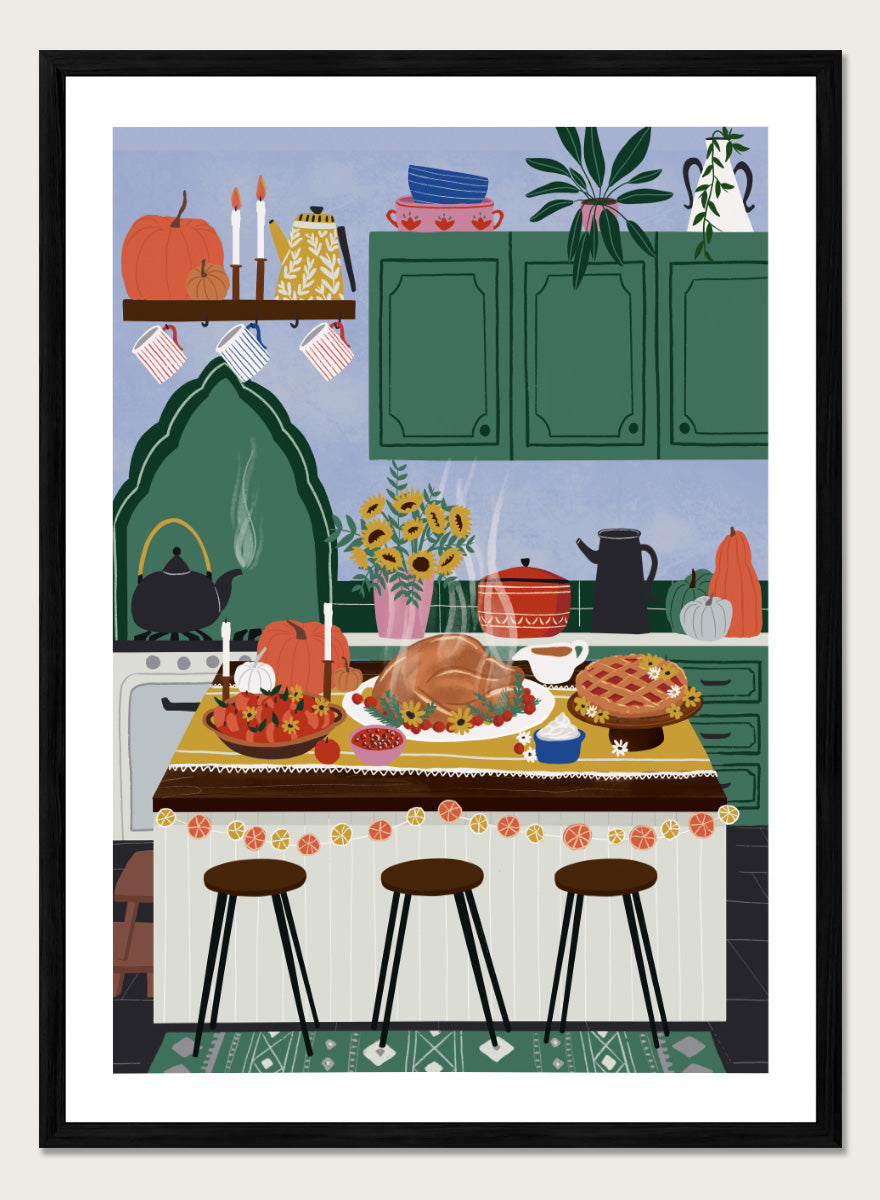 A framed art print depicting a cozy, stylized autumn kitchen scene with a large roasted turkey on a table covered in fall dishes, green cabinets, pumpkins, and three bar stools. Cozy Thanksgiving Kitchen by Ceyda Alasar kitchen art print featuring a turkey feast, pie, pumpkins, flowers, candles, and warm autumn decor.