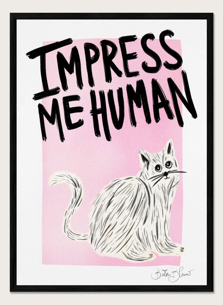 Cartoon cat with 'Impress Me Human' text on a pink background. Cat Owner. Impress Me Human by Baroo Bloom is a playful cat art print featuring hand-drawn illustration and humorous typography. Officially licensed wall poster with optional framing.