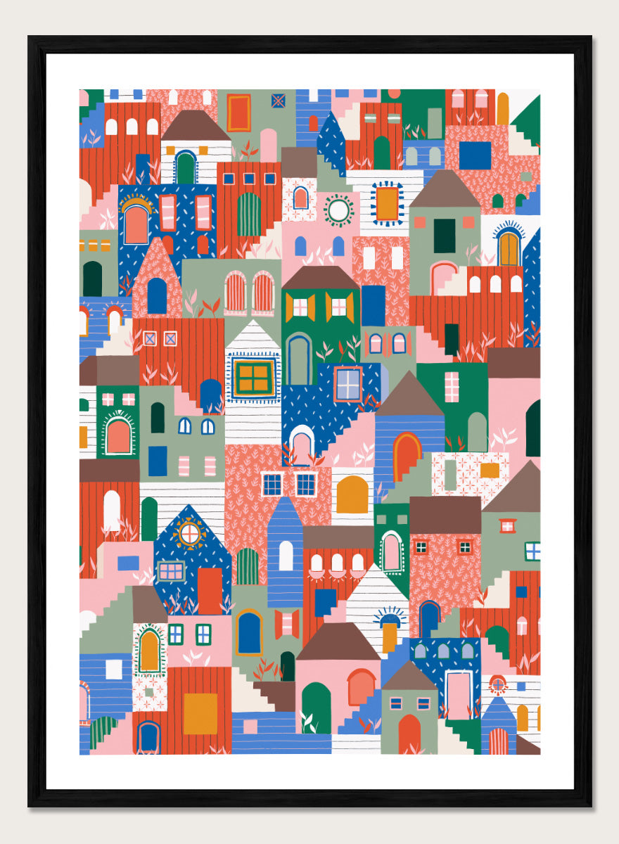 A colorful art print featuring a dense, stylized illustration of houses and buildings in a playful, patterned village scene. Whimsical Cityscape Charm by Ceyda Alasar city art print featuring stacked colorful houses, patterned walls, winding stairs, and playful architectural details.