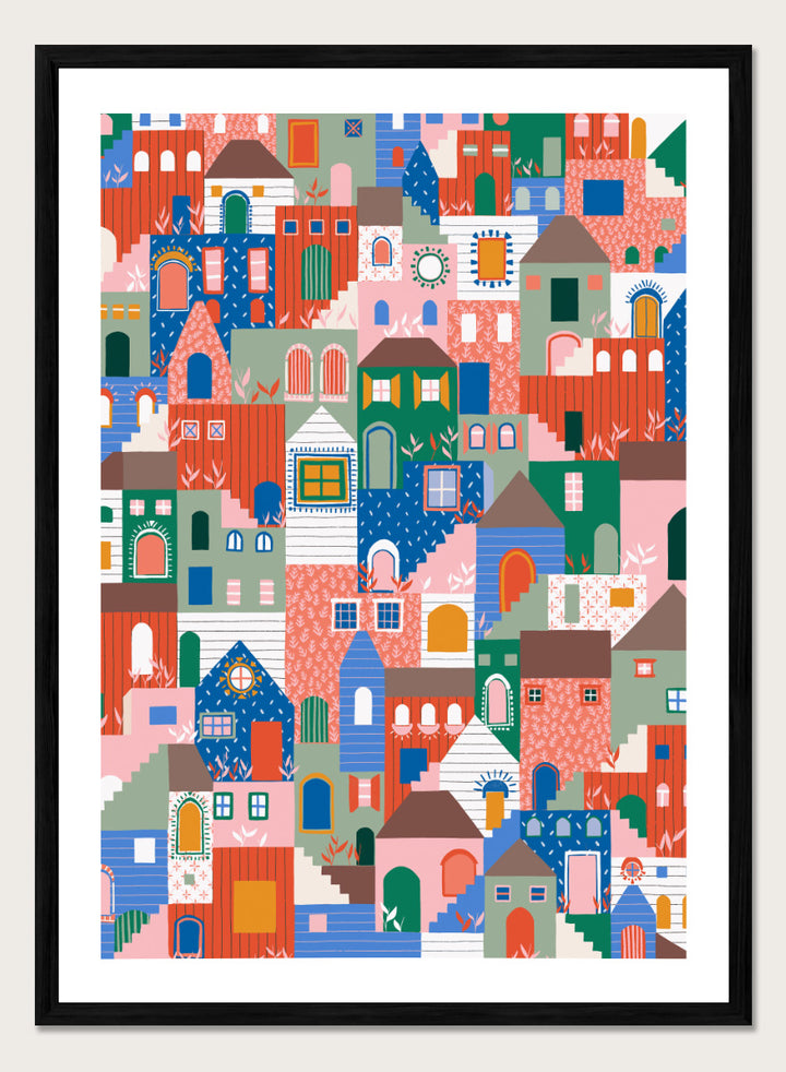 A colorful art print featuring a dense, stylized illustration of houses and buildings in a playful, patterned village scene. Whimsical Cityscape Charm by Ceyda Alasar city art print featuring stacked colorful houses, patterned walls, winding stairs, and playful architectural details.