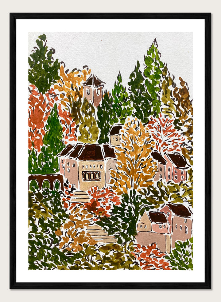 A framed art print featuring a hand-drawn, stylized landscape of a hillside village with beige buildings, brown roofs, and dense trees in green, yellow, orange, and red tones. Shop Autumn Hillside Village by Rushati Chowdhury, a colorful autumn landscape art print with hillside homes, winding steps, dense trees, and warm fall tones.