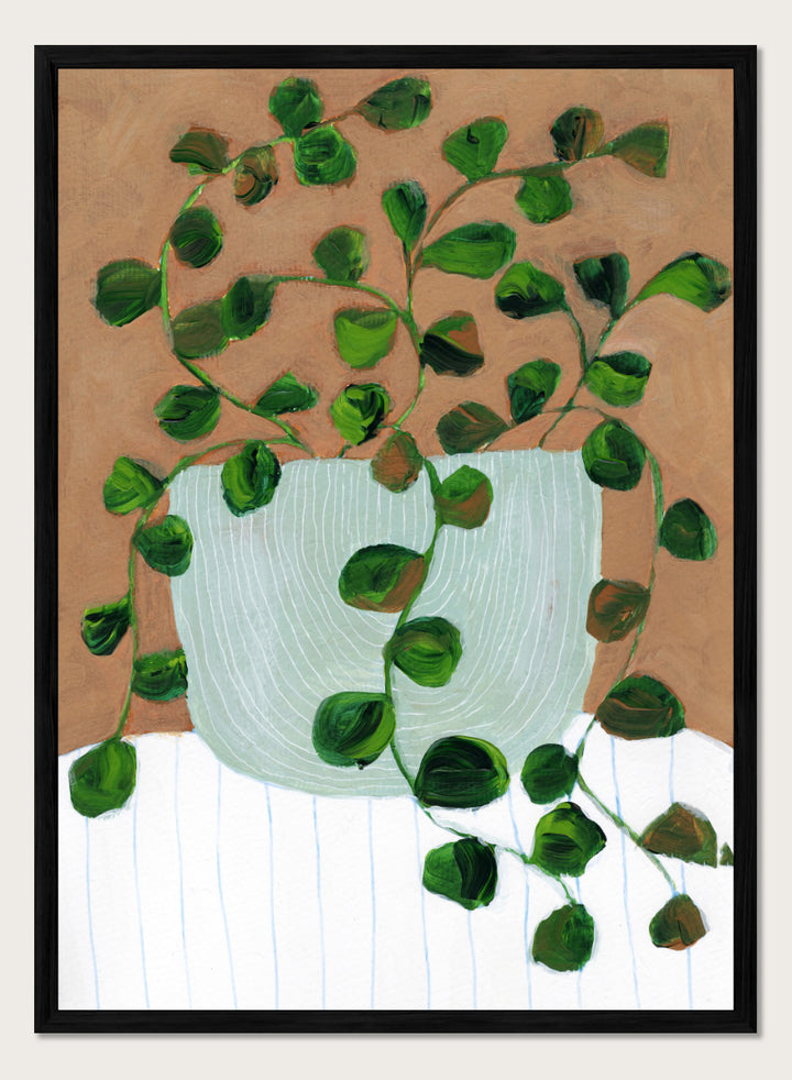 Shop Warm Houseplant Pot by Nikita Jariwala, a botanical wall art print poster featuring a trailing houseplant in a green pot with warm green tones.