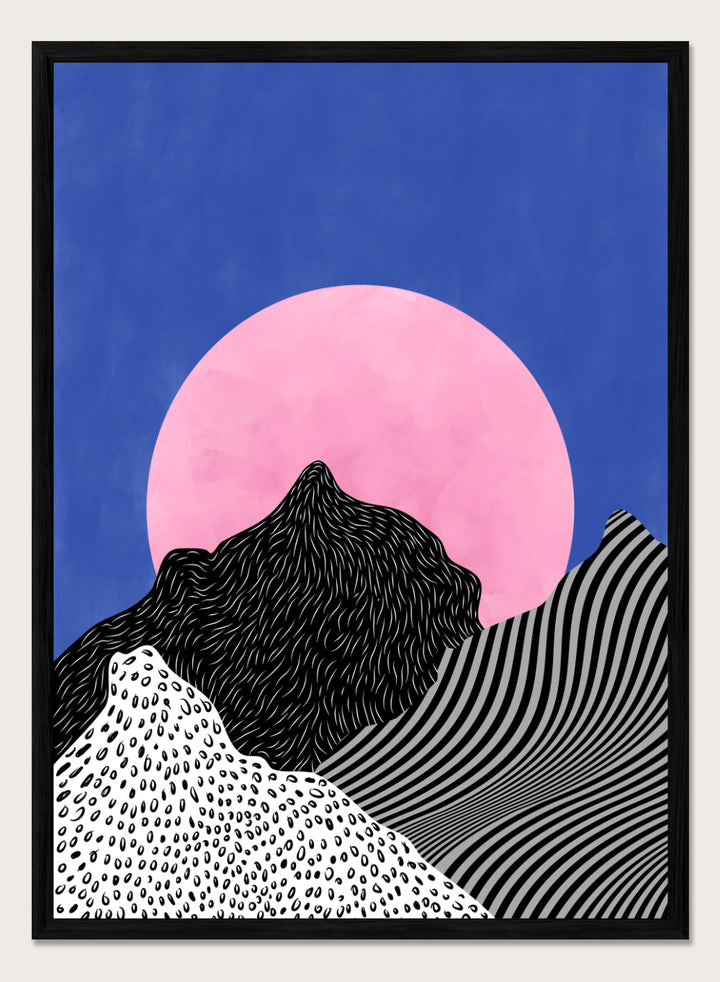 Artistic depiction of mountains with a pink moon in a blue sky. Surreal Peaks View by Elena Ristova is a minimalist abstract landscape print with bold mountains and a pink sun. Officially licensed wall poster with framing.