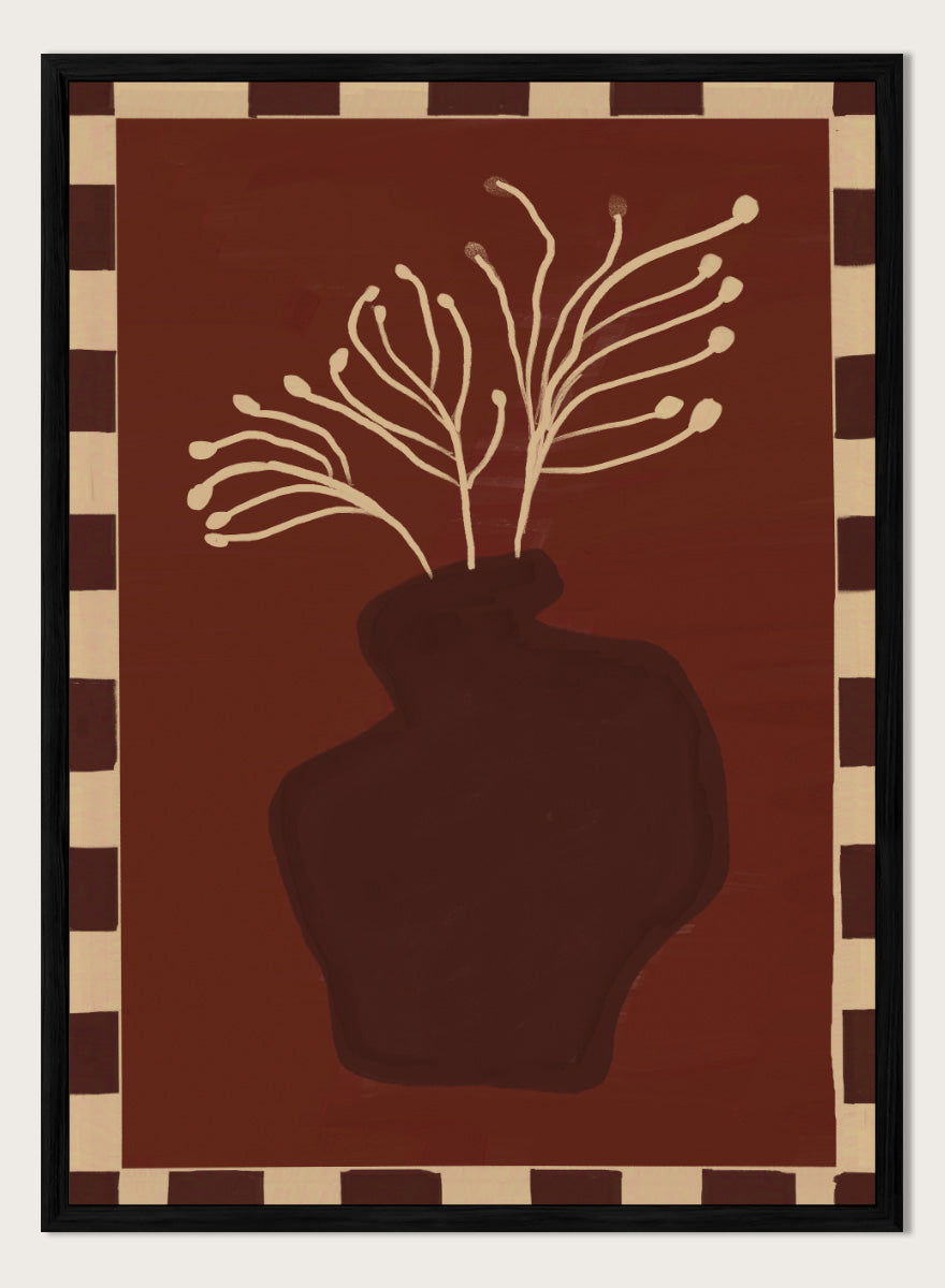 An art print featuring a dark brown abstract vase with cream branching stems on a deep reddish-brown background, framed by a beige and dark brown checkered border. Minimalist Vase Plant by The Art Concept still life art print featuring a dark vase, cream stems, checkerboard border, and warm rust-brown tones.