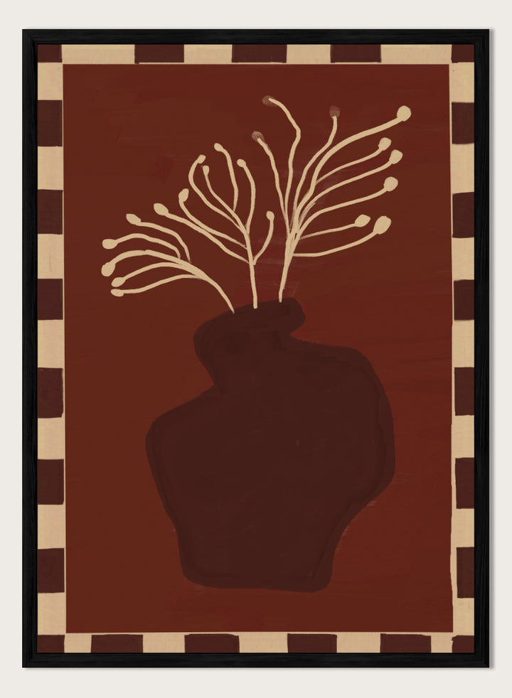 An art print featuring a dark brown abstract vase with cream branching stems on a deep reddish-brown background, framed by a beige and dark brown checkered border. Minimalist Vase Plant by The Art Concept still life art print featuring a dark vase, cream stems, checkerboard border, and warm rust-brown tones.