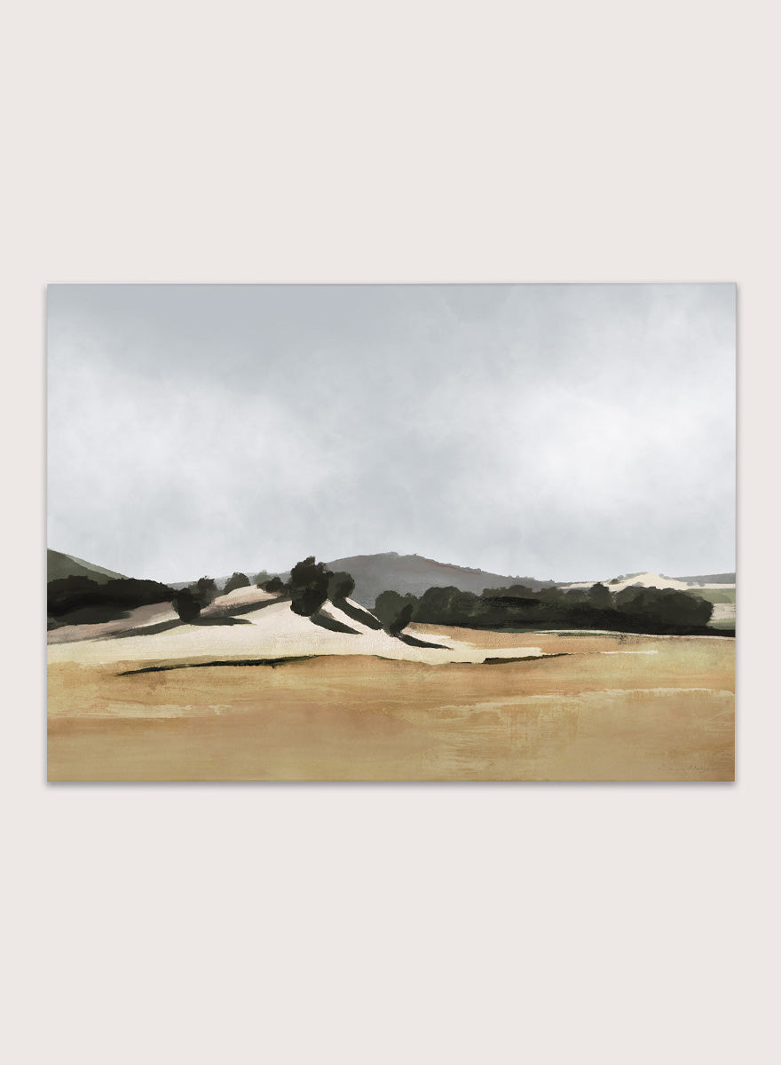 Shop Lazy Afternoon by Dan Hobday, a warm landscape art print featuring golden fields, dark trees, rolling hills, and soft late-summer tones.