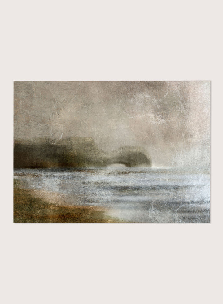 A framed abstract landscape art print featuring textured waves and a distant rocky shoreline in muted beige, gray, brown, and white tones. Shop Dusk by Dan Hobday, a moody landscape art print featuring misty water, low hills, earthy neutral toned nature, and soft layered brush texture.